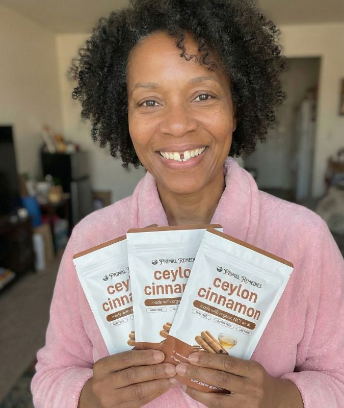 Primal Remedies customer with three supplement pouches