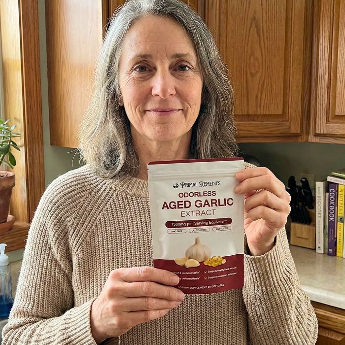 Primal Remedies customer holding Aged Garlic Extract